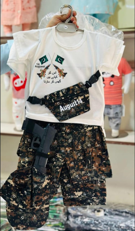 Children's outfit with white shirt and camouflage pants on a hanger.